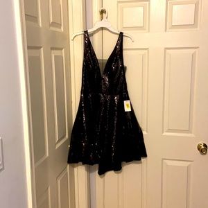 Cute homecoming dress black, short, sequin with neck and low back, tags on.